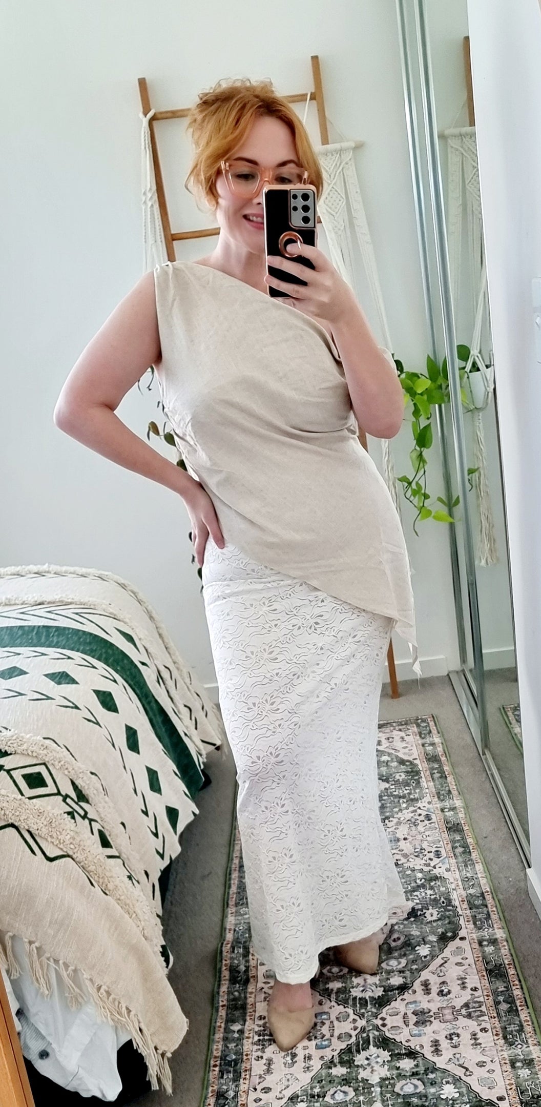 Tegan wearing the Terra Set in Oatmeal by By Frankie. Features an asymmetrical linen top and sheer embroidered lace maxi skirt. Tegan is an AU size 10 and wears the Medium.