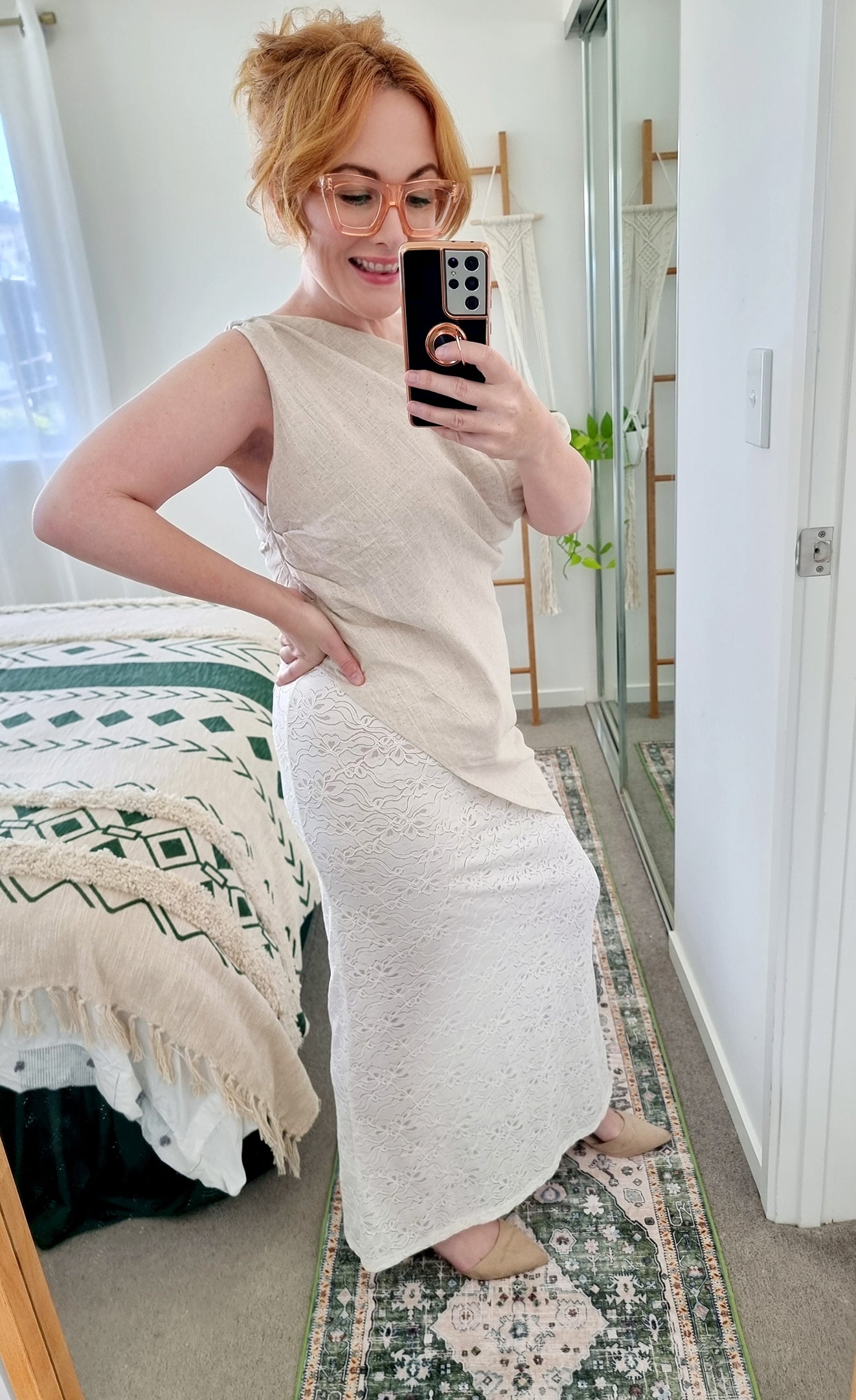 Tegan wearing the Terra Set in Oatmeal by By Frankie. Features an asymmetrical linen top and sheer embroidered lace maxi skirt. Tegan is an AU size 10 and wears the Medium.
